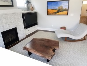 Walnut live edge coffee table in family room             